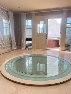 Skywalk Suite | Living area | 40-inch LCD TV with satellite channels, TV, Netflix