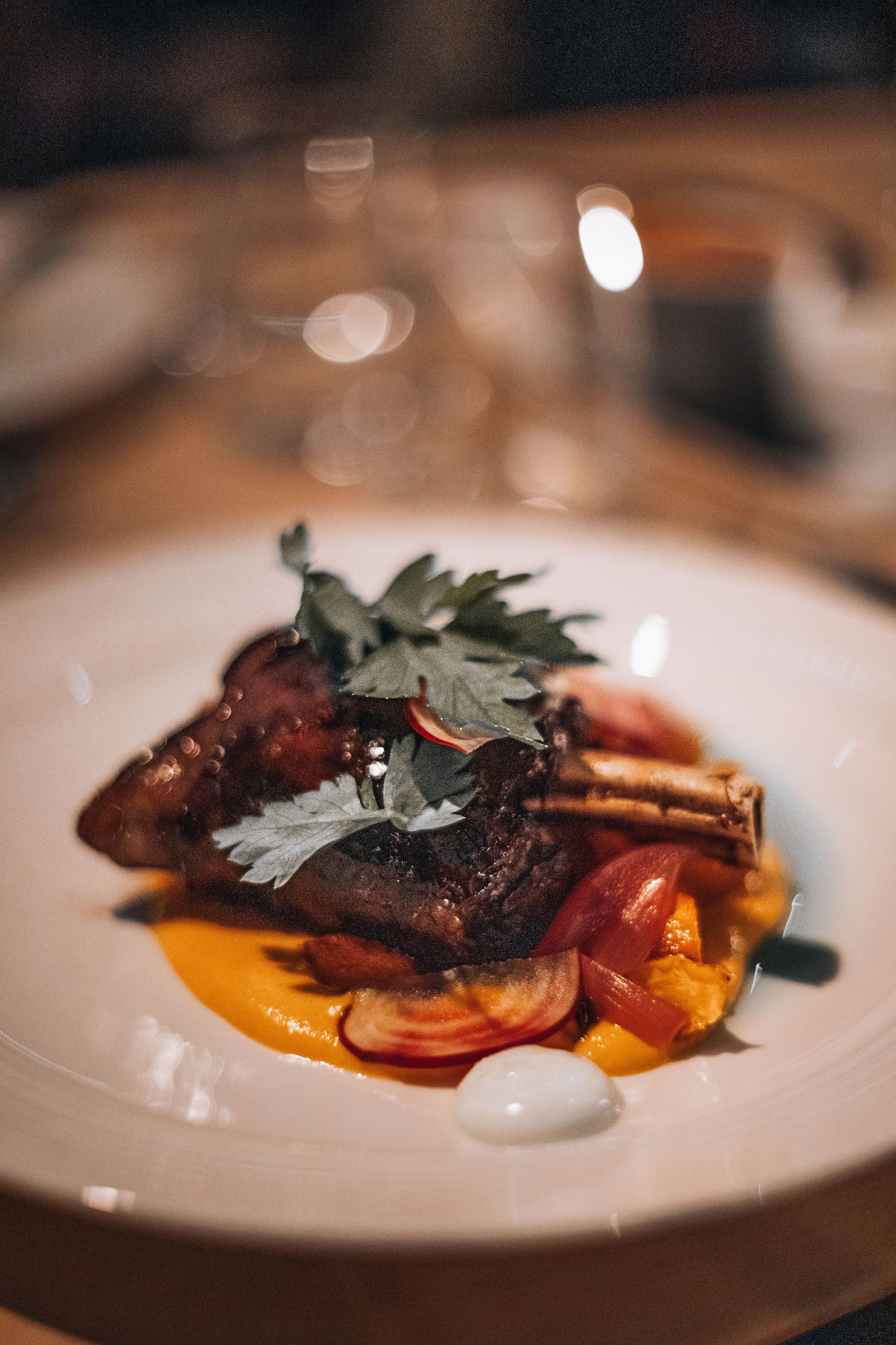 A plate of food with a garnish on top.