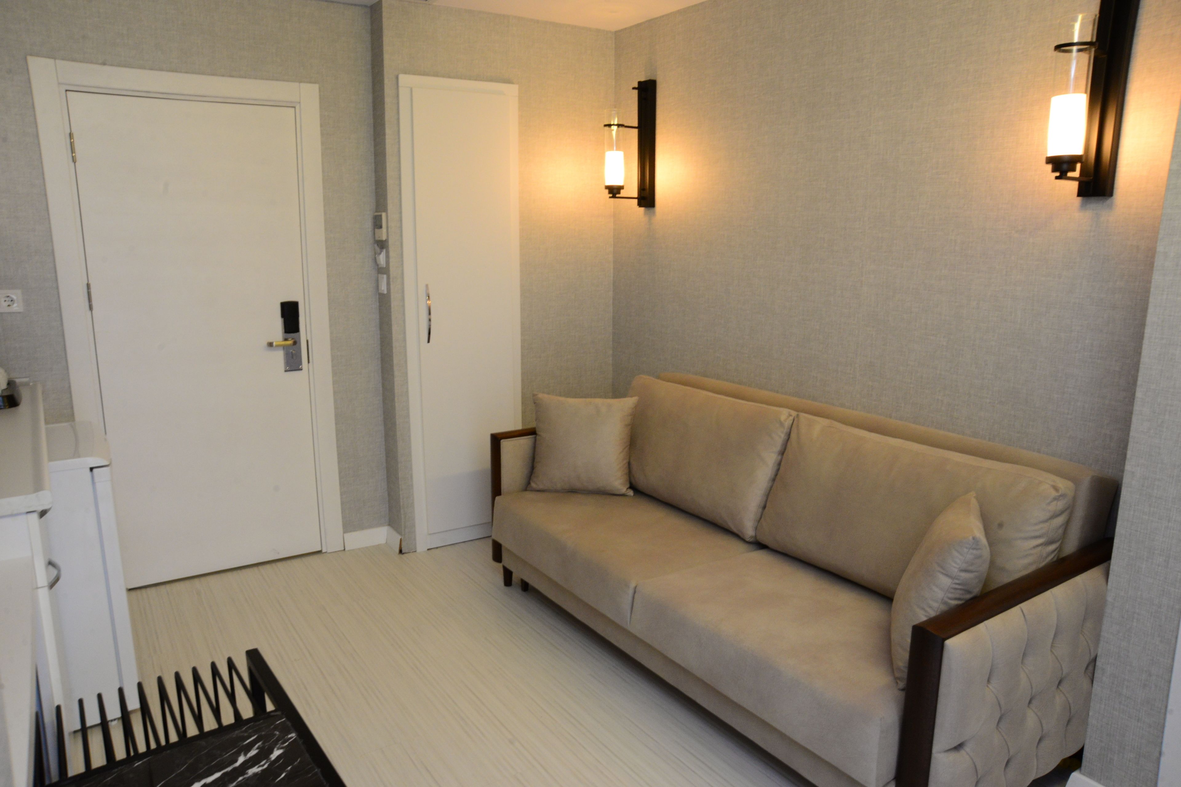 superior suite, 1 queen bed with sofa bed, city view | living room | flat-screen tv