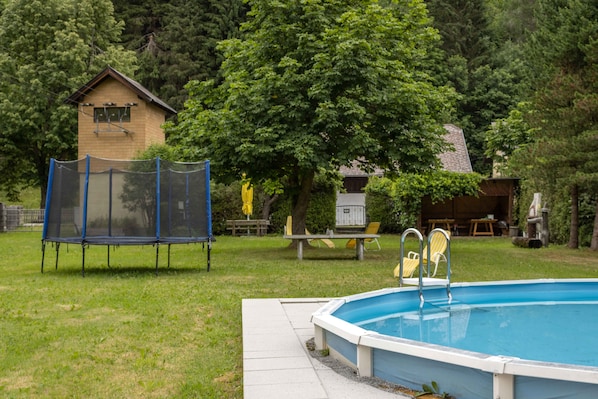 Seasonal outdoor pool, pool loungers