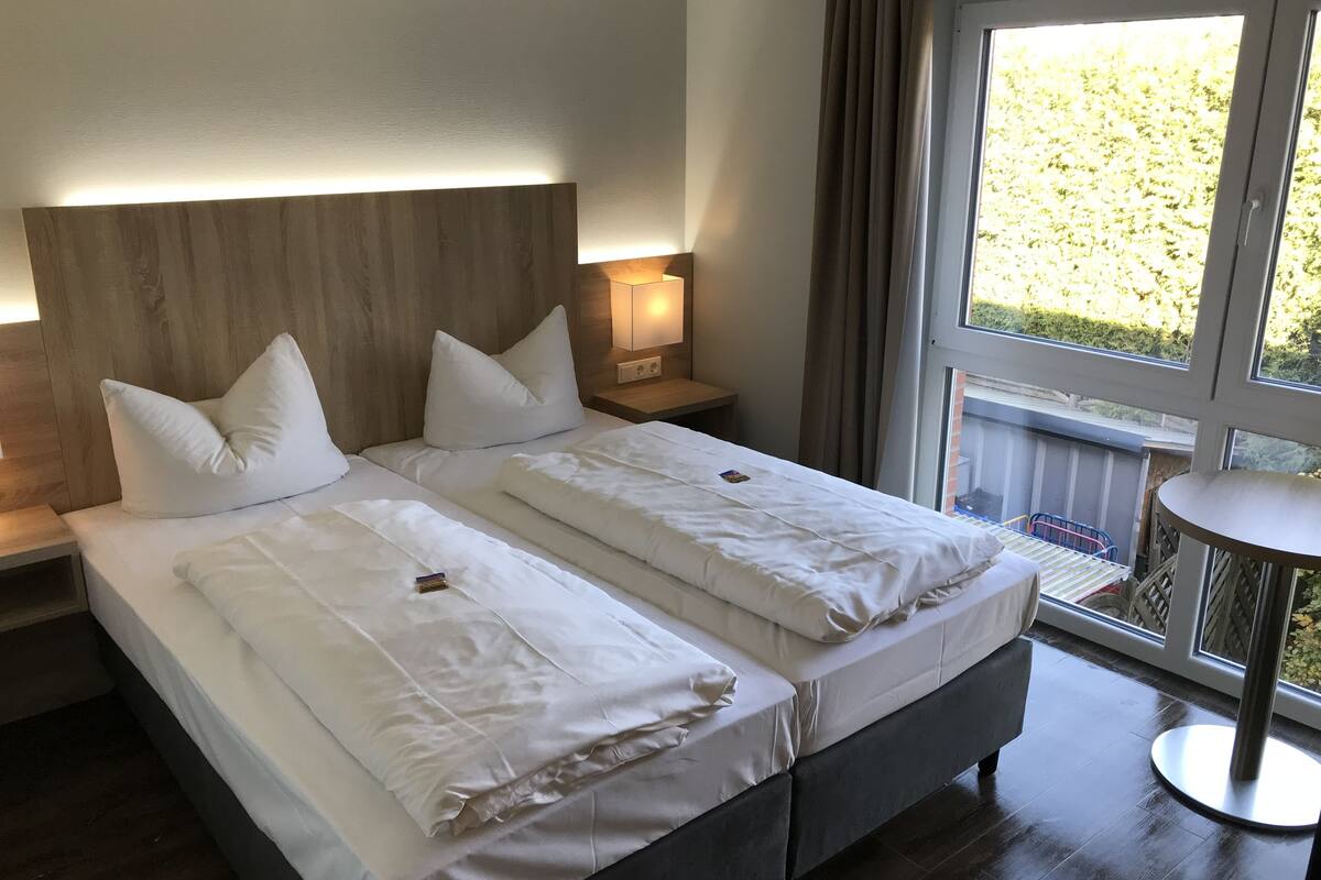 comfort double or twin room, 1 bedroom, garden area | 1 bedroom, blackout curtains, soundproofing, free wifi