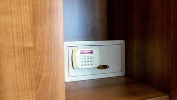 A keypad lock on a wooden door, likely for a hotel room.