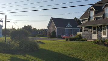 Country Inn's charming porch and well-manicured lawn invite relaxation.