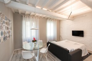 Deluxe Apartment, 1 Bedroom (Location: Via Dei Castellani 10) | Living area | Flat-screen TV