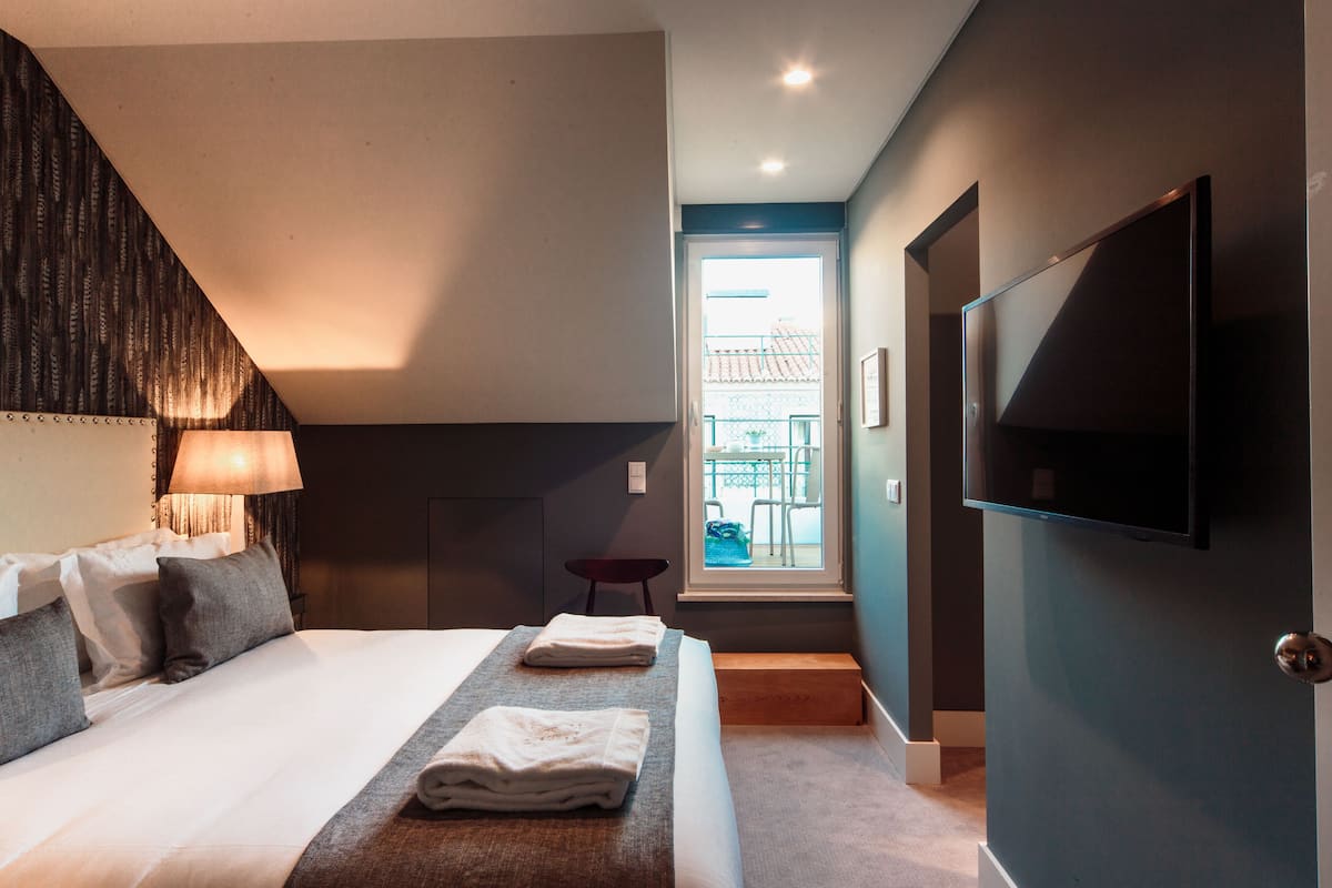 Kamer, 1 twee- of 2 eenpersoonsbedden, terras (Mansard) | 1 slaapkamer, een minibar, een kluis op de kamer