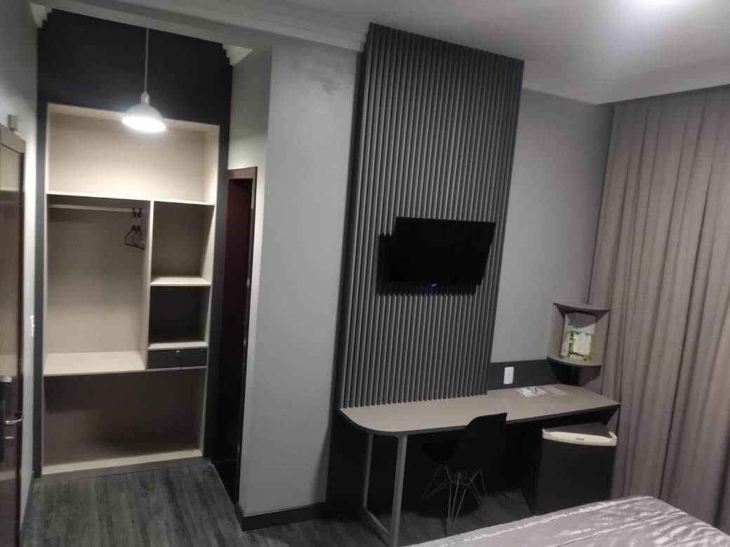 minibar, desk, blackout curtains, iron/ironing board