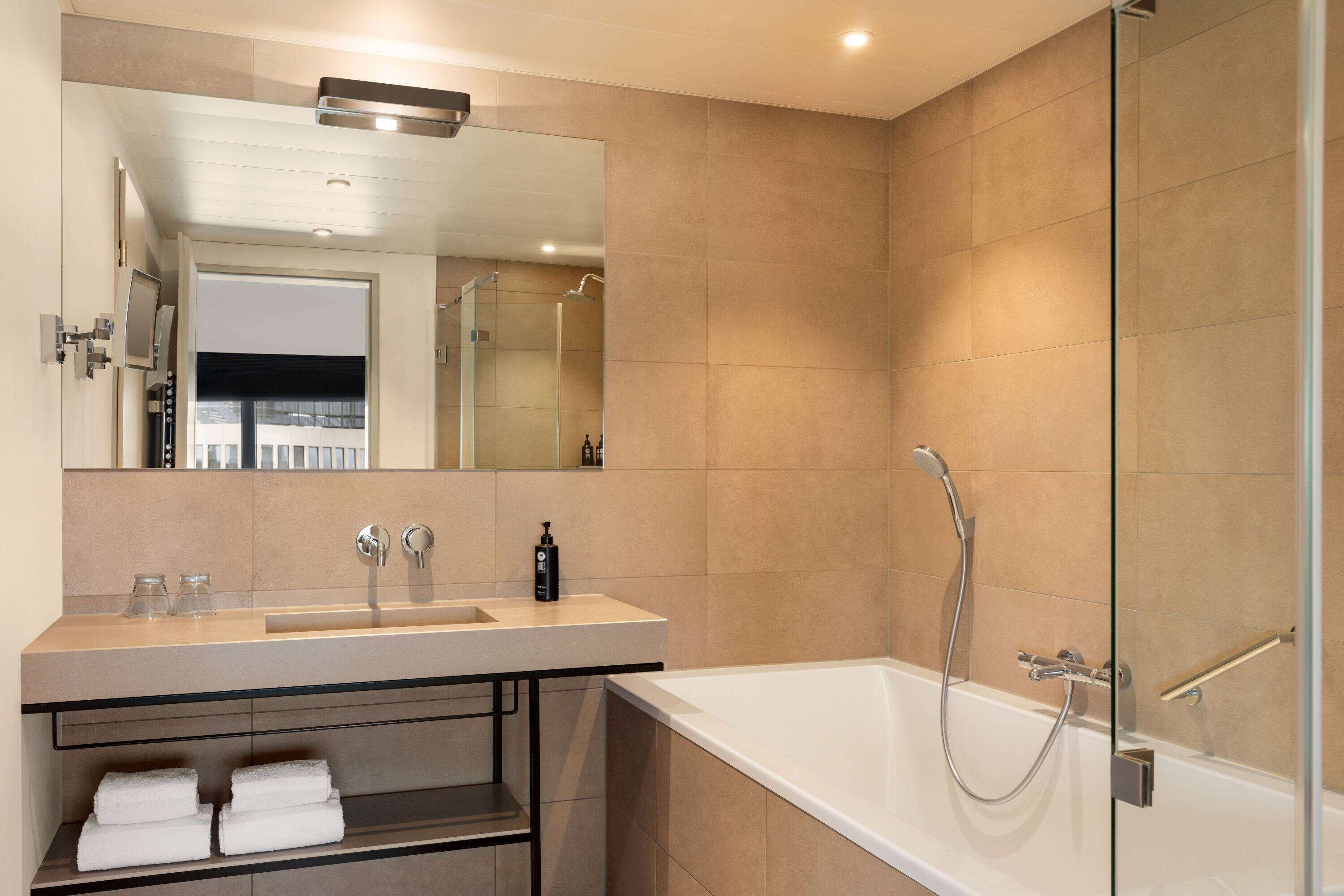 eco-friendly toiletries, hair dryer, towels