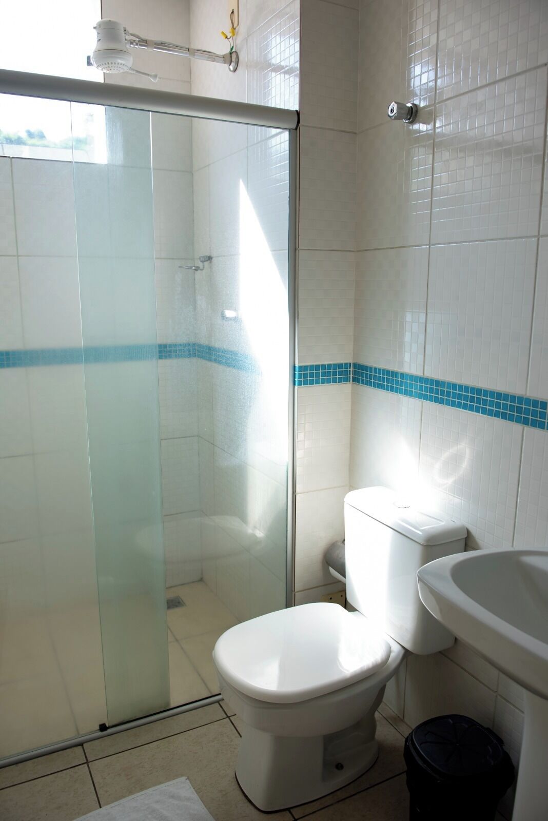 shower, rainfall showerhead, towels, toilet paper