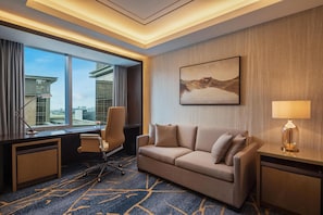 Deluxe Suite, 1 King Bed with Sofa bed | Living area | 55-inch LCD TV with cable channels, TV, DVD player