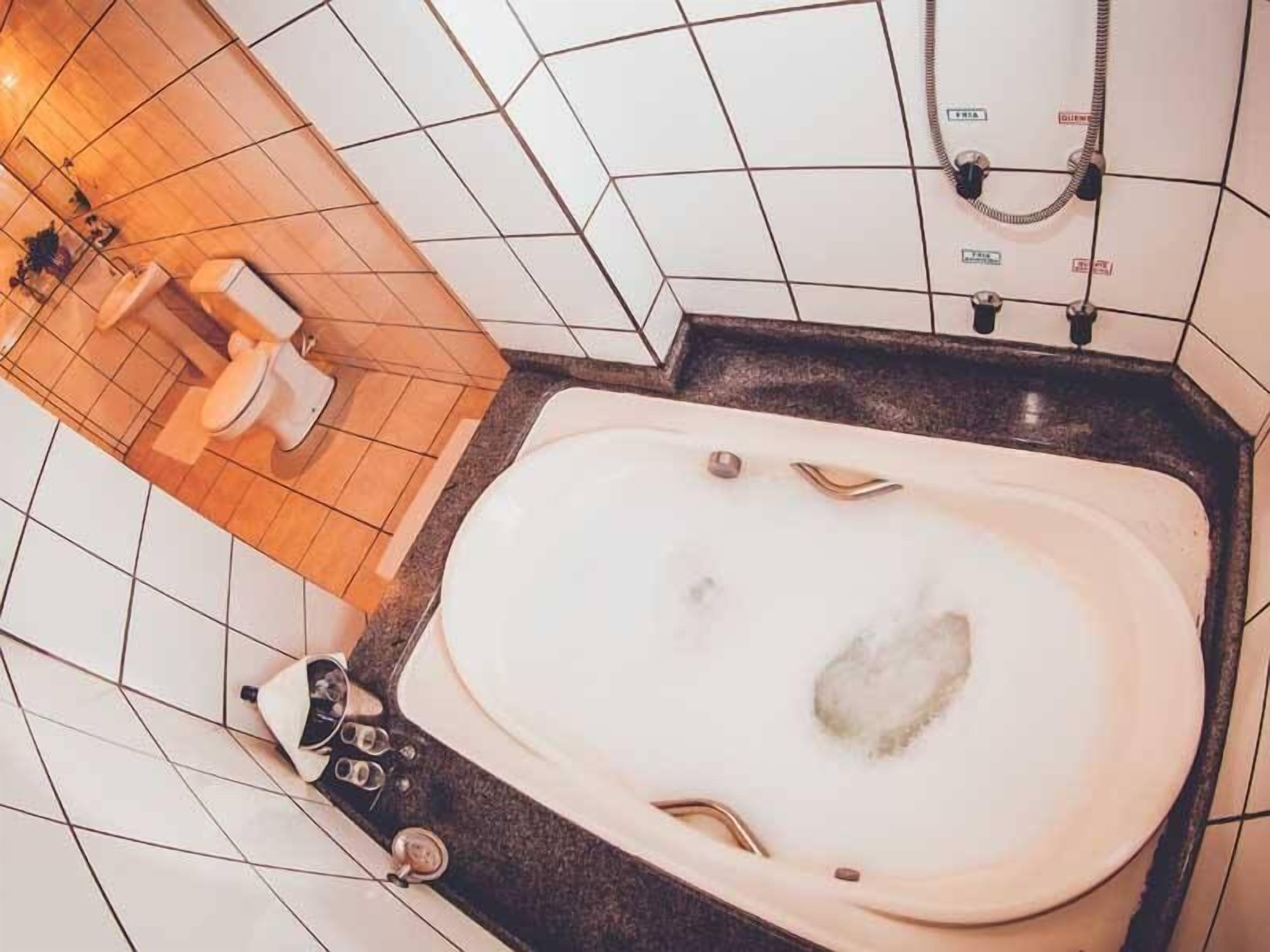 luxury suite | bathroom | shower, free toiletries, hair dryer, towels