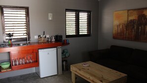 Family Apartment, 2 Bedrooms | Living area | TV - Guesthouse Balot's Place (Kralendijk)