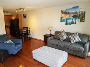 Standard Condo, 1 Bedroom, Balcony, Mountain View | Living area | 40-inch flat-screen TV with cable channels, fireplace, DVD player - PRC Annex - Pet Friendly (Canmore)