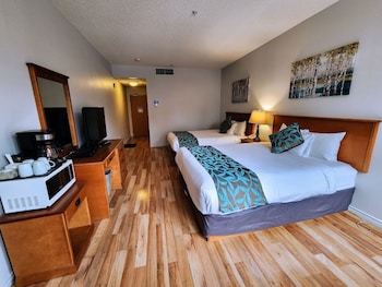 Economy Double Room Single Use, 2 Queen Beds, Accessible, Pool Access | Individually decorated, individually furnished, desk, iron/ironing board at Sunset Mountain Inn and Spa