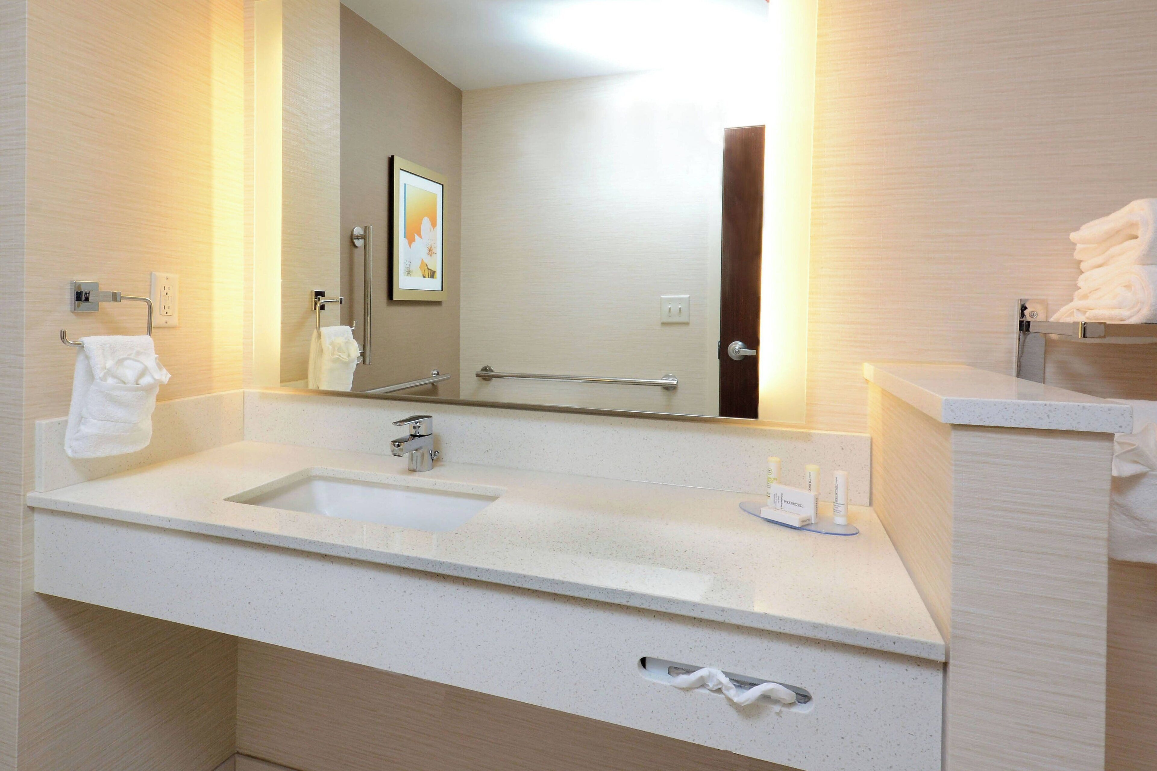 pillow-top beds, desk, laptop workspace, blackout curtains