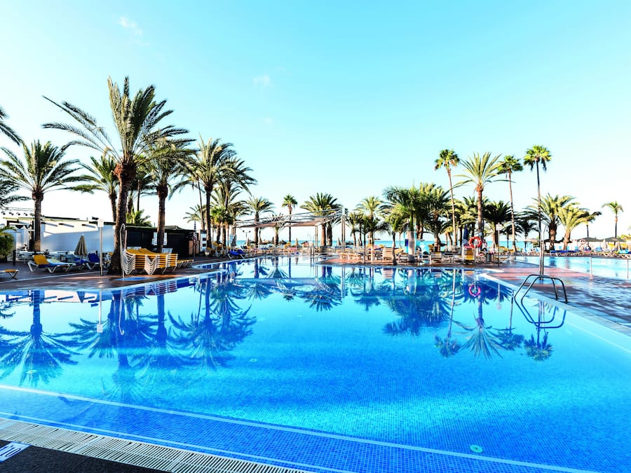 3 outdoor pools, open 9:00 AM to 6:00 PM, pool umbrellas, pool loungers
