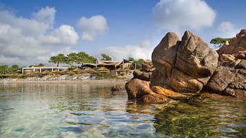 Private beach, white sand, sun-loungers, beach umbrellas