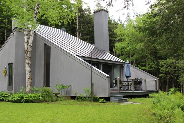 Falcon house in spring, view to deck and garden and brook
