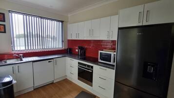 Two Bedroom Unit Apartment | Private kitchen | Espresso maker, coffee/tea maker, electric kettle