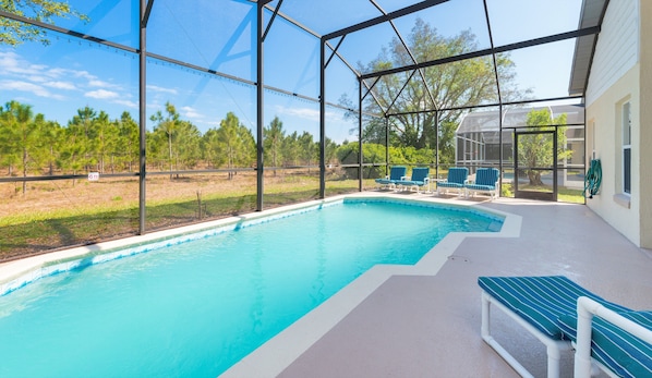 Outdoor pool, a heated pool, sun loungers