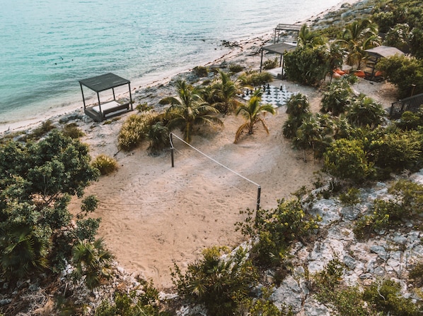 On the beach, sun-loungers, beach towels