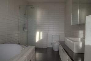 A modern bathroom with a bathtub, toilet, and shower. - 3 Bedroom Sea View Sunset Apartment SDV120-By Samui Dream Villas (Koh Samui)