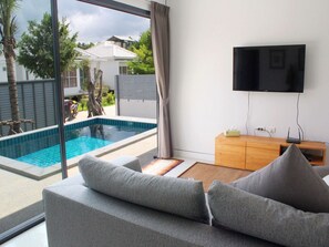 3-Bedroom Pool Villa | Living room | Flat-screen TV