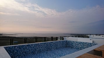 Outdoor pool, a rooftop pool, sun loungers