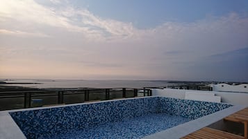 Outdoor pool, a rooftop pool, pool loungers