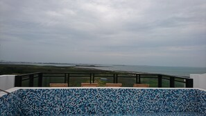 Outdoor pool, a rooftop pool, sun loungers