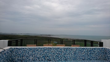 Outdoor pool, a rooftop pool, pool loungers