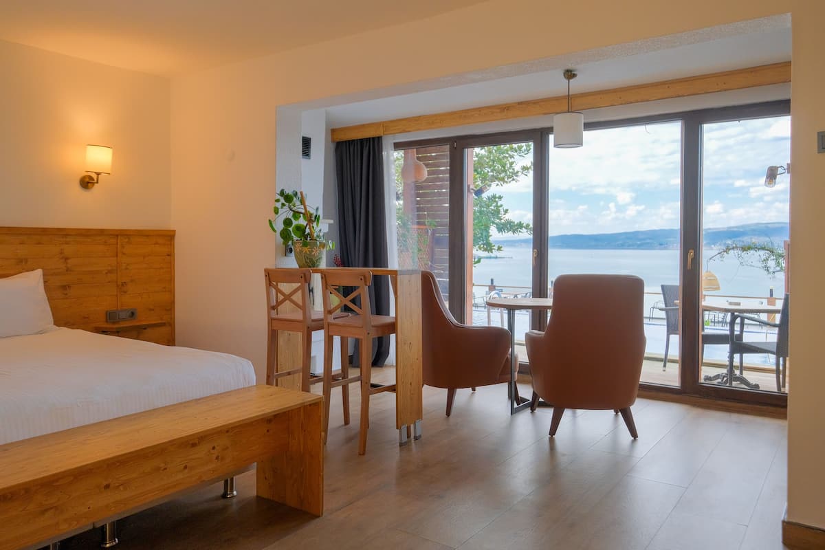 deluxe room, 1 double bed with sofa bed, lake view (shared pool access from inside the room) | 1 bedroom, premium bedding, tempur-pedic beds, minibar