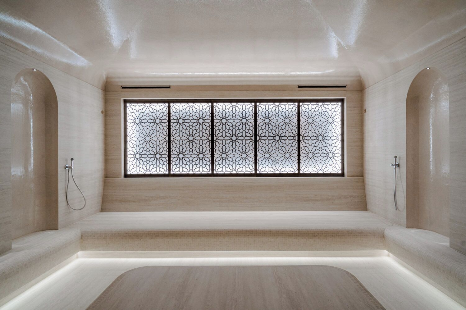 A spacious, modern bathroom with a large window, a shower area, and a bathtub.