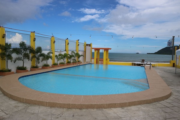 Outdoor pool, open 7 AM to 10 PM, pool umbrellas