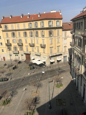 A multi-story building with balconies, a courtyard, and a street view. - La Casa di Arturo (Turin)