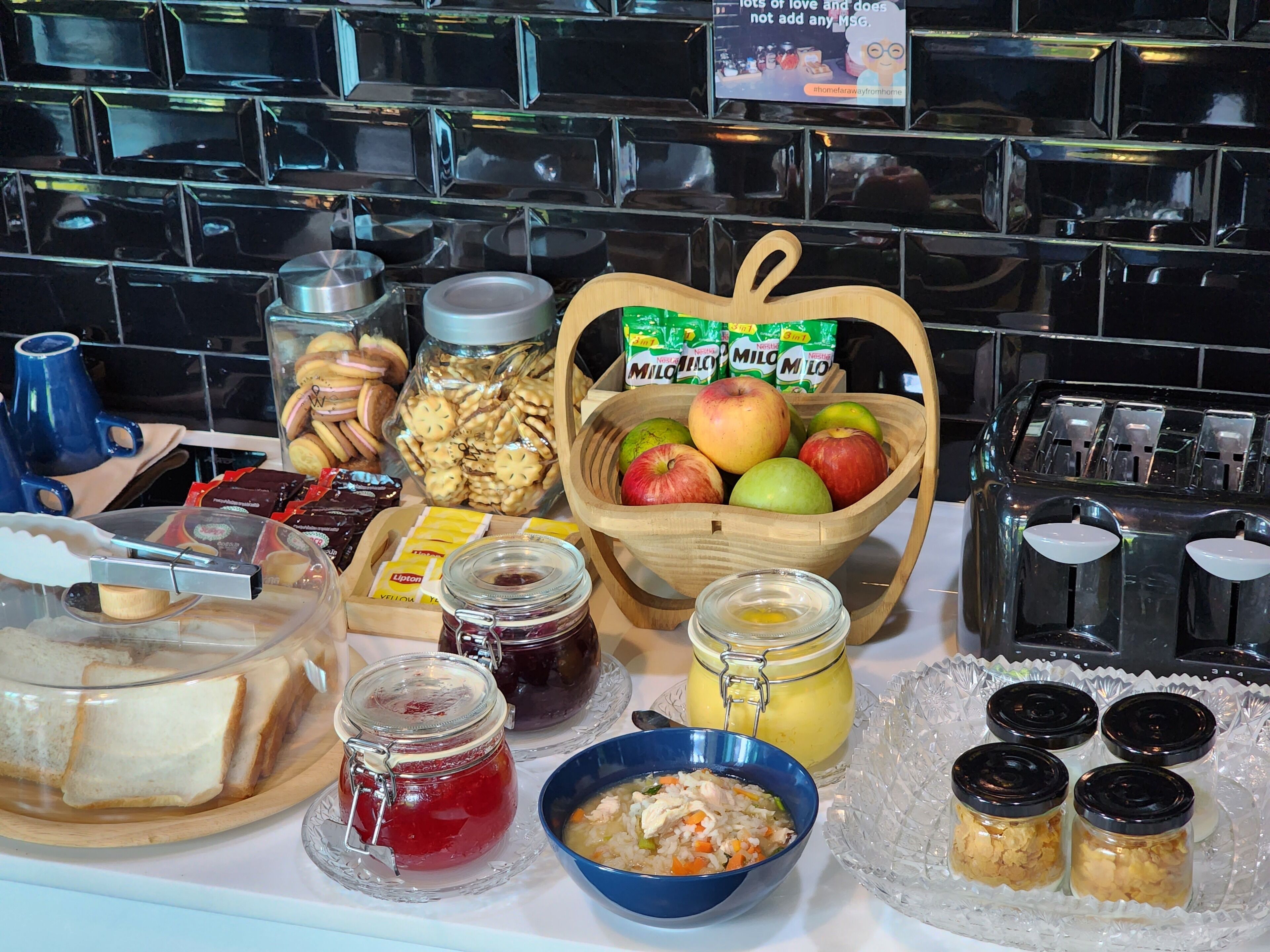 A breakfast buffet with various food items and condiments.