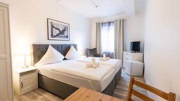 Desk, laptop workspace, free WiFi, bed sheets