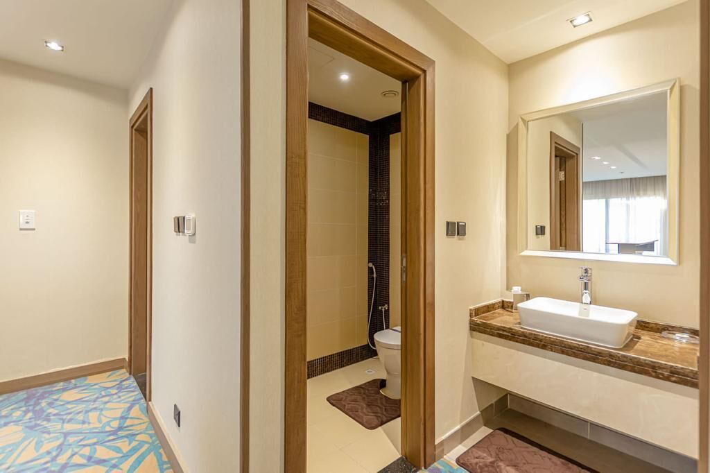 presidential penthouse | bathroom | designer toiletries, hair dryer, bathrobes, slippers