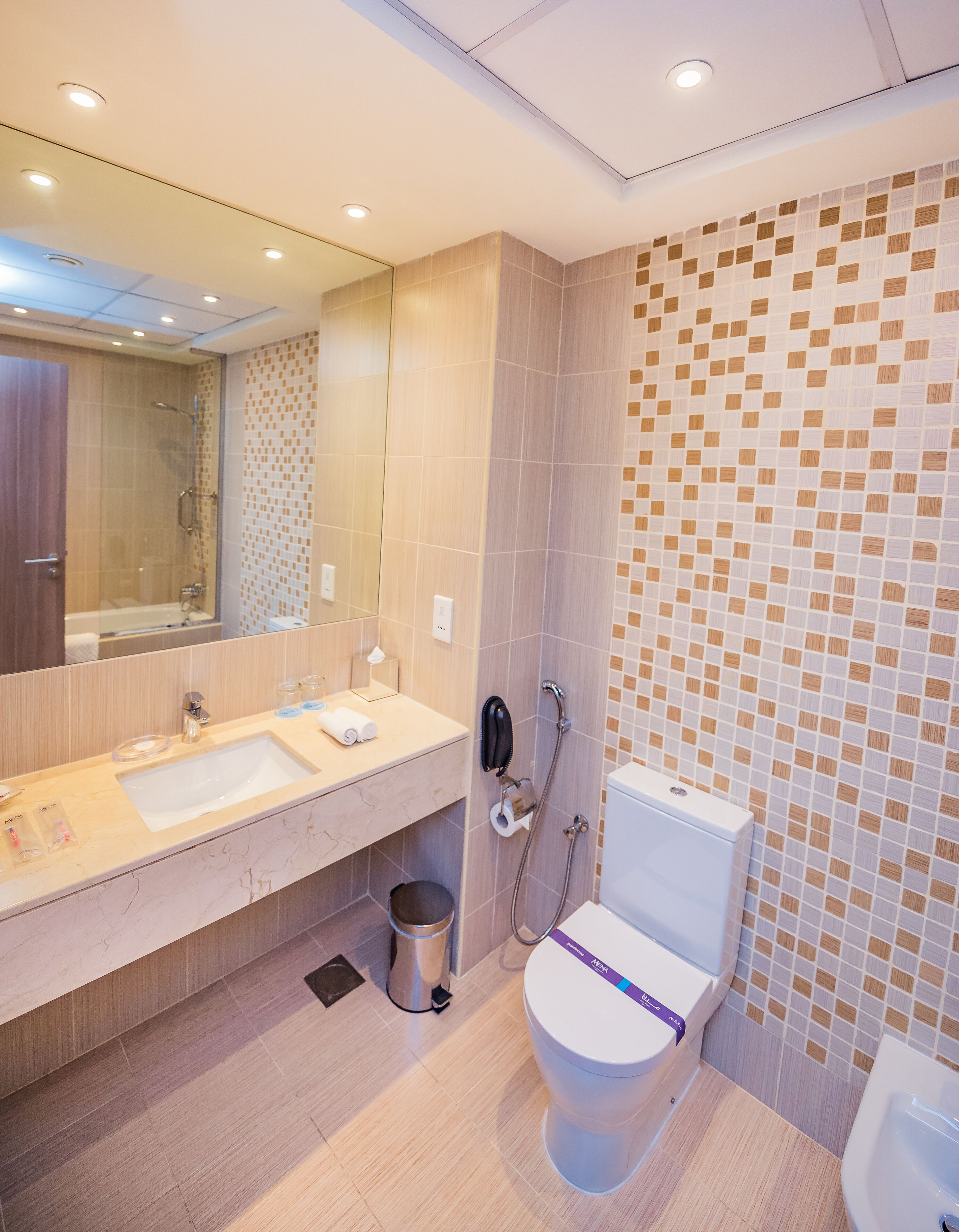 designer toiletries, hair dryer, bathrobes, slippers