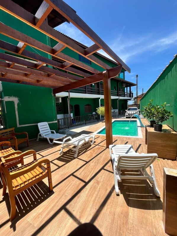 Outdoor pool, open 8:00 AM to 8:00 PM, pool loungers