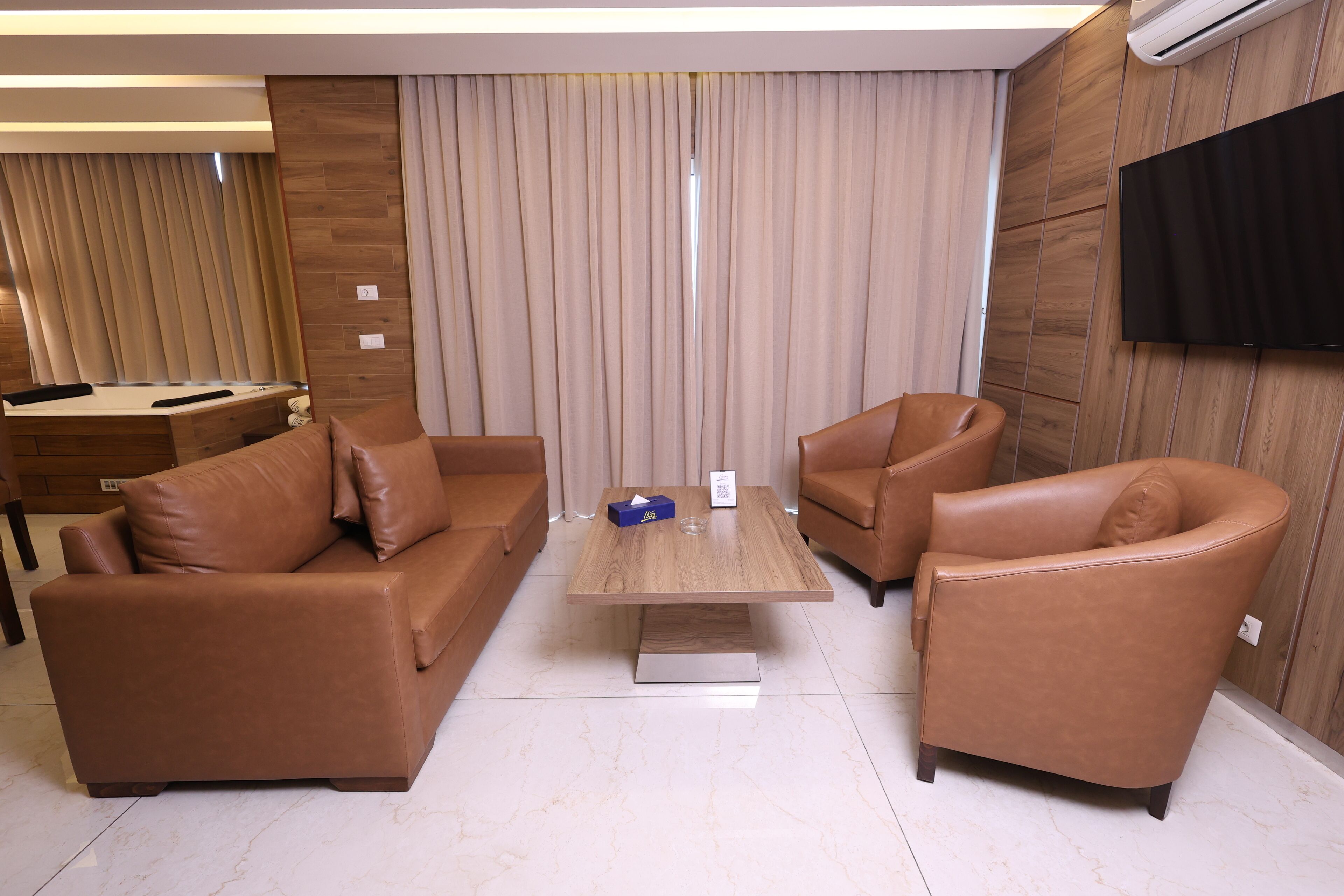 superior suite | living area | lcd tv, fireplace