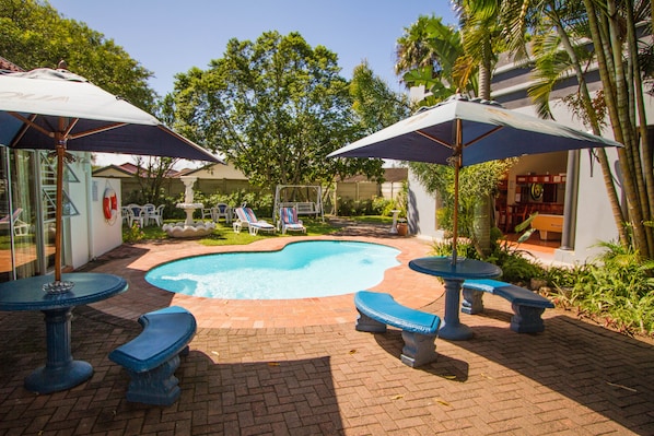 Outdoor pool, pool umbrellas, sun loungers
