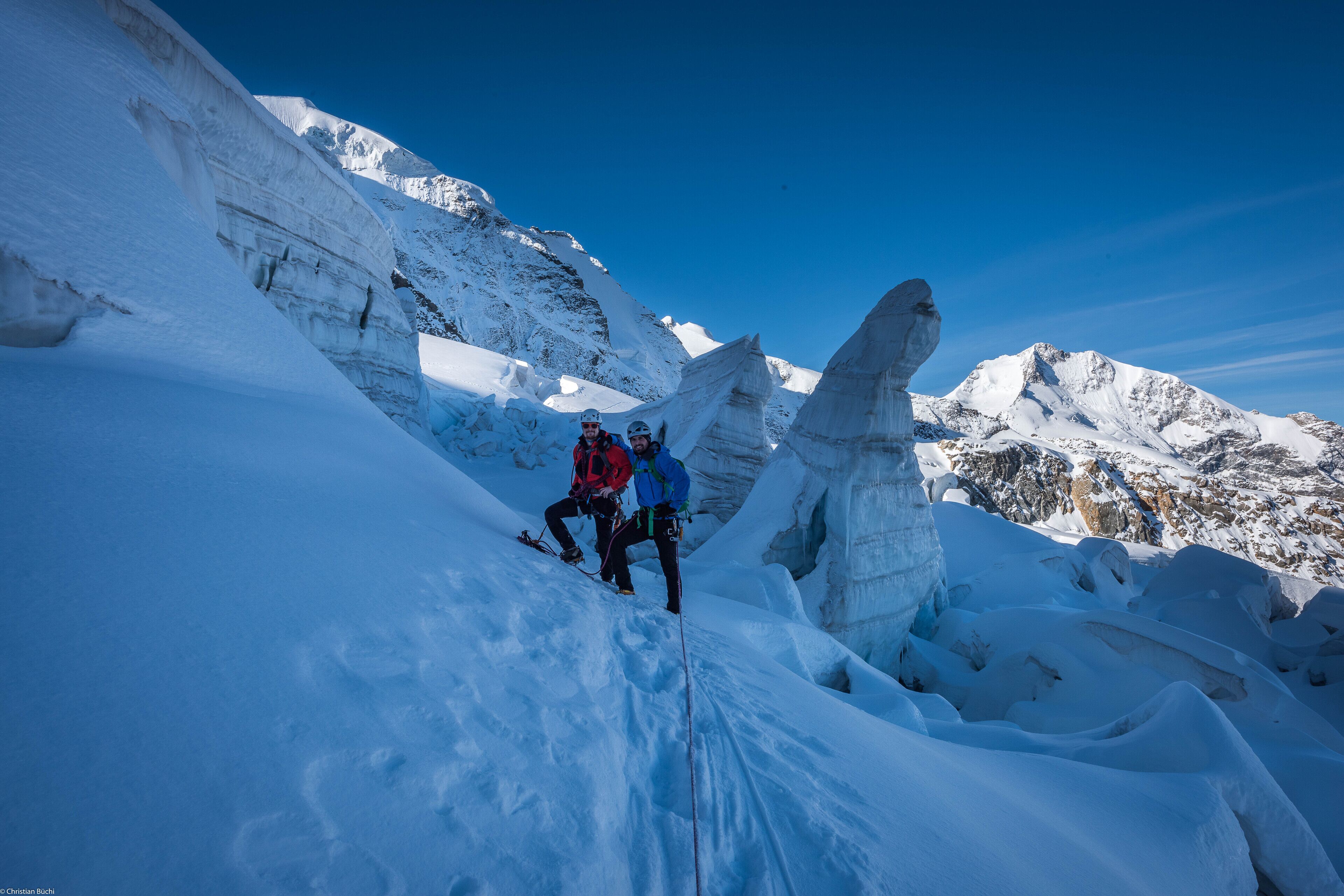 A snowy mountain landscape with a clear sky.