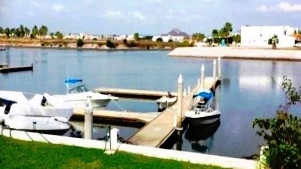A marina with several boats docked at the pier. - Casa en Marina Cid (Mazatlán)