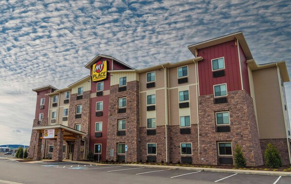 A multi-story hotel with a prominent 'My Place' sign, featuring a stone facade and multiple windows. - My Place Hotel - Nashville East-I40/Lebanon, TN (Lebanon)