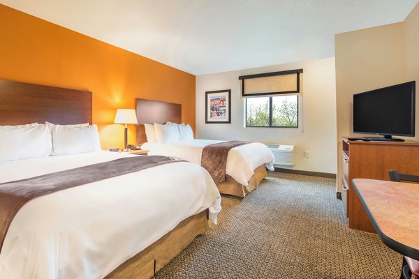 Premium bedding, pillowtop beds, desk, laptop workspace