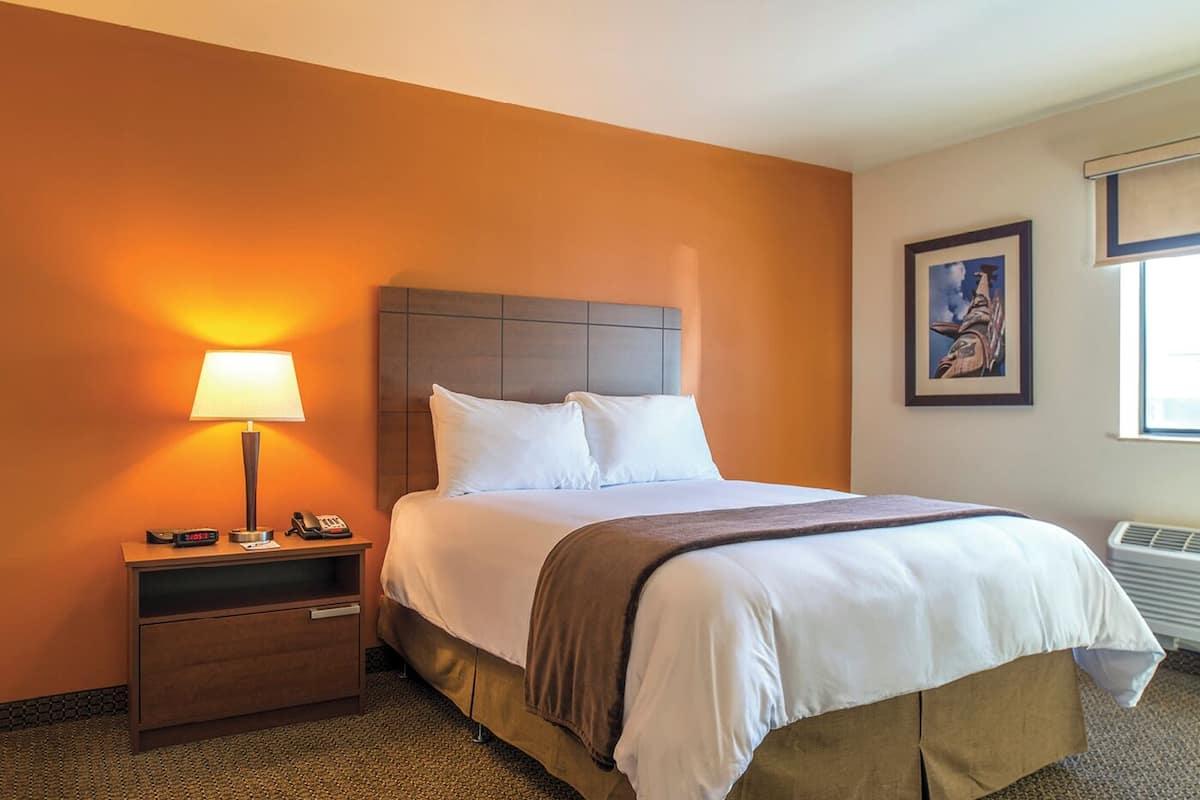 Premium bedding, pillow-top beds, desk, laptop workspace