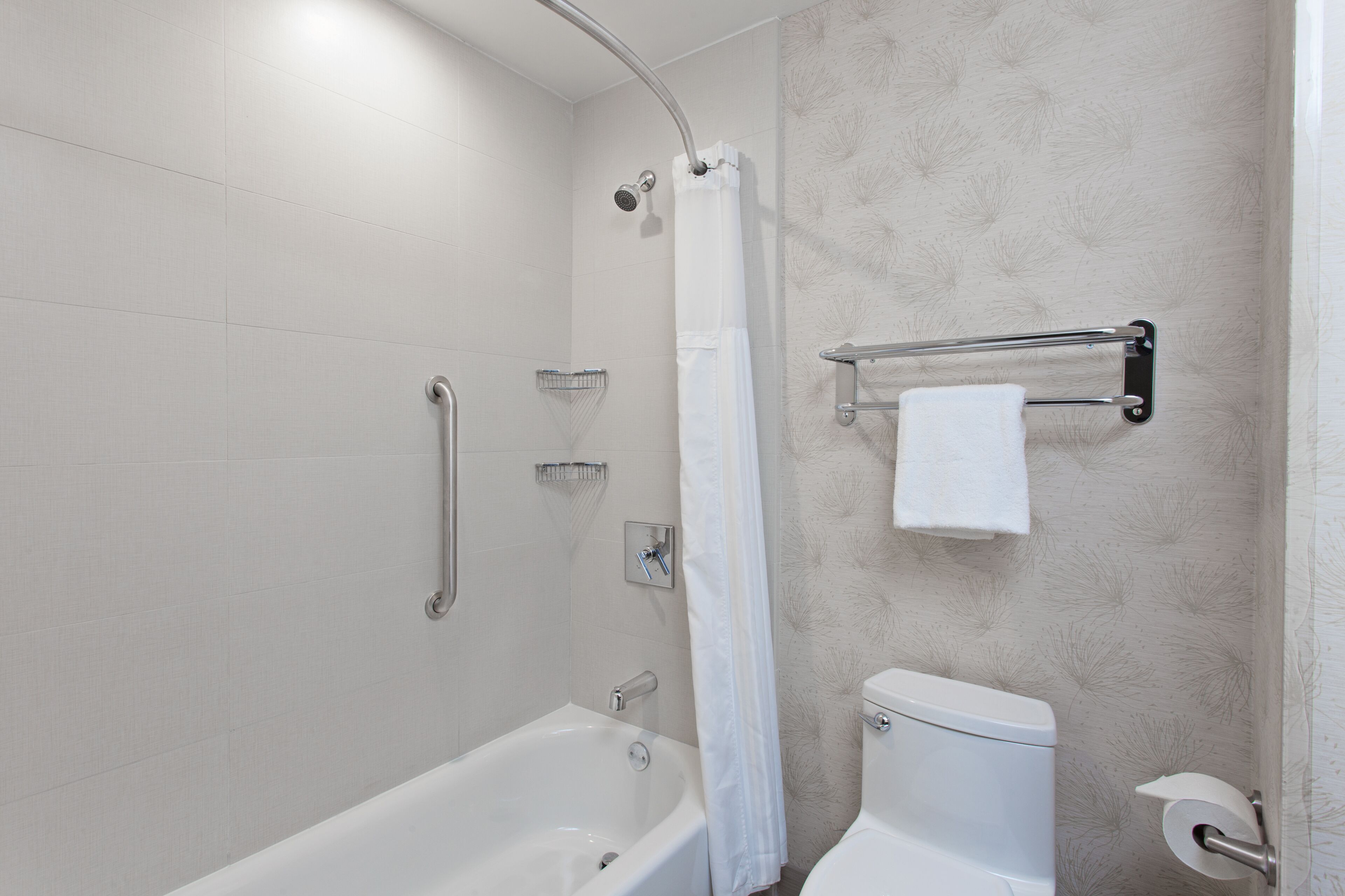 Designer toiletries, hair dryer, towels