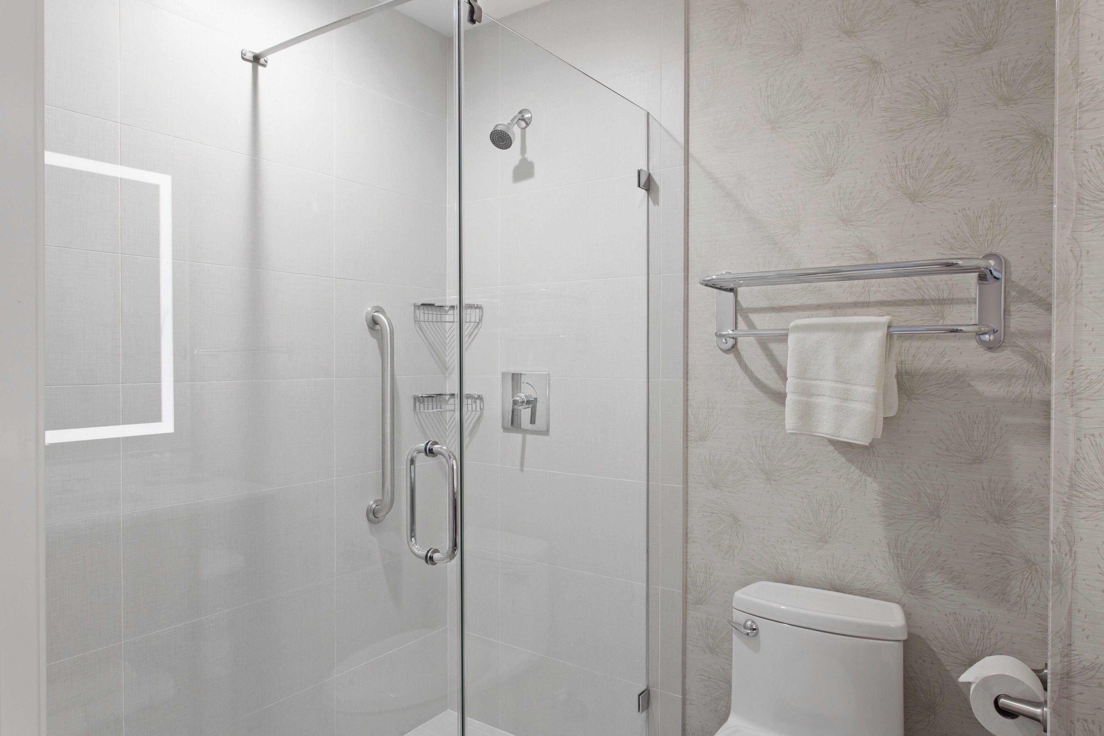 Designer toiletries, hair dryer, towels