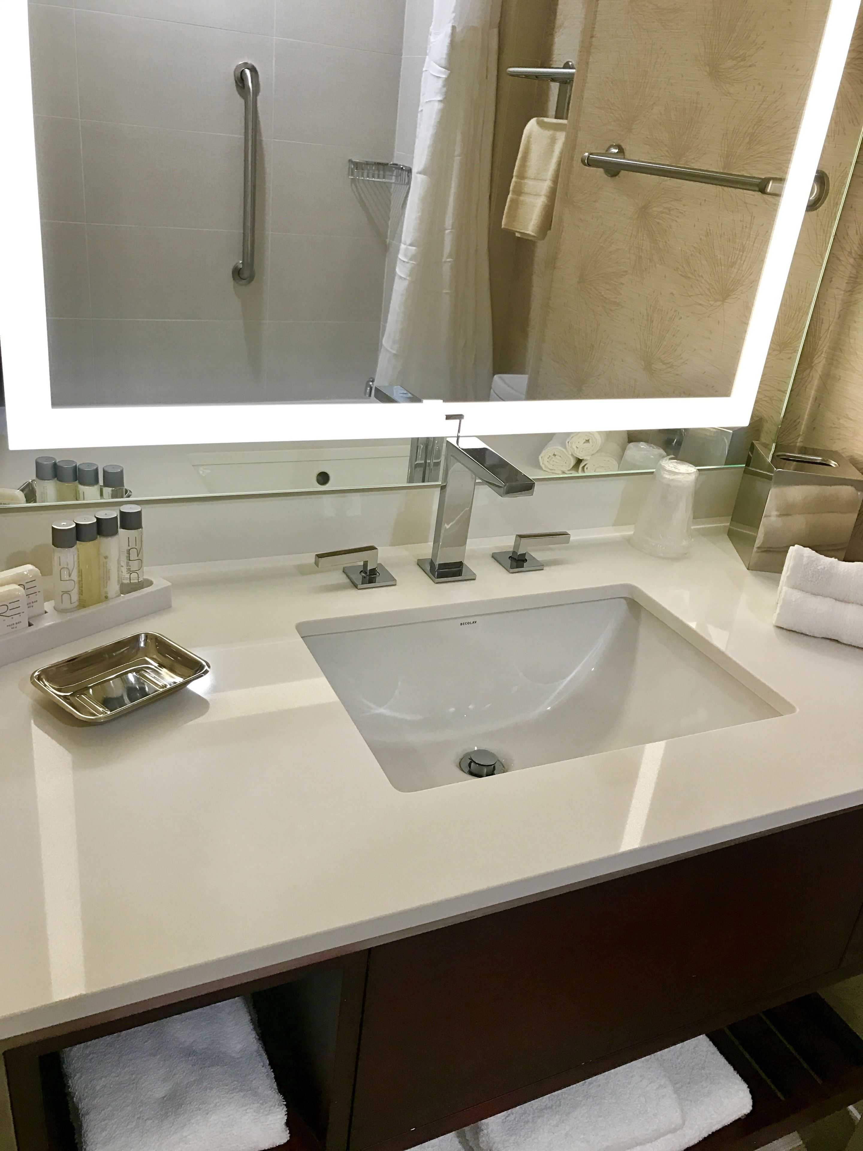 Designer toiletries, hair dryer, towels