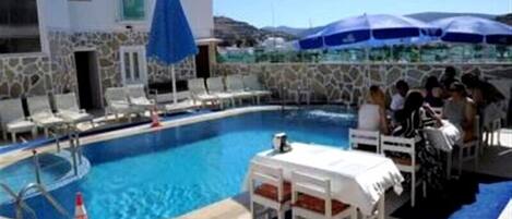 Seasonal outdoor pool, pool umbrellas, sun loungers